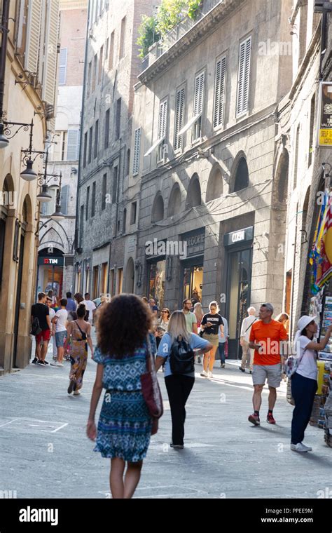 Italian People Walking In The Narrow Streets Of Medieval Siena Siena