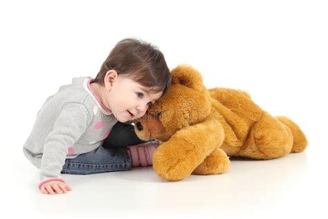 Baby Playing With A Teddy Bear Stock Photo - Image: 29038090