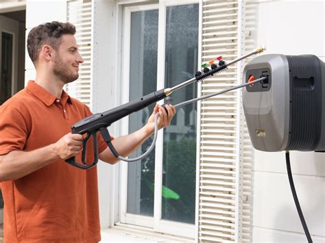 This Powerful Pressure Washer Has A Rotating Wall Mounted Design