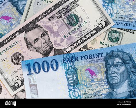 US dollar and new Hungarian forint banknotes mixed. Forint US dollar exchange rate Stock Photo ...