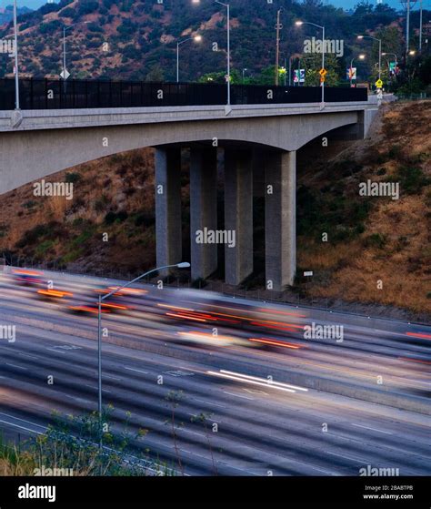 View Of Bridge Over Freeway Overpass At Night On Los Angeles