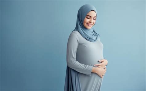 Premium Photo Happy Pregnant Muslim Woman Touching Her Belly