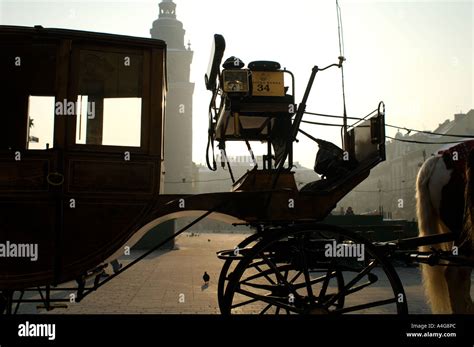 A Carriage On Krakow S Main Market Square Rynek Glowny With The Clock