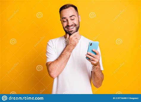 Portrait Of Optimistic Guy Look Telephone Wear White T Shirt Isolated