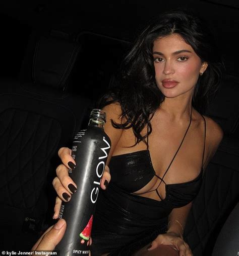 Kylie Jenner Puts On A Busty Display In A Plunging Black Mini Dress As