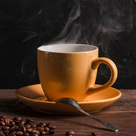 Caf Caliente En Taza Con Cuchara En Plato Foto Gratis