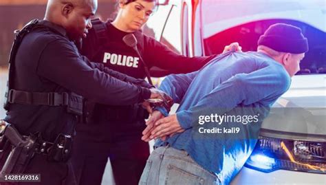 Officer Handcuffing Photos And Premium High Res Pictures Getty Images