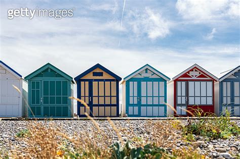 Colorful Wooden Beach Huts At Pebble Beach In Cayeux Sur Mer France