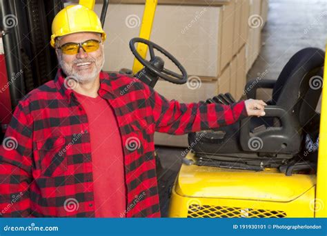 Man Standing By Fork Lift Truck Smiling Stock Image Image Of