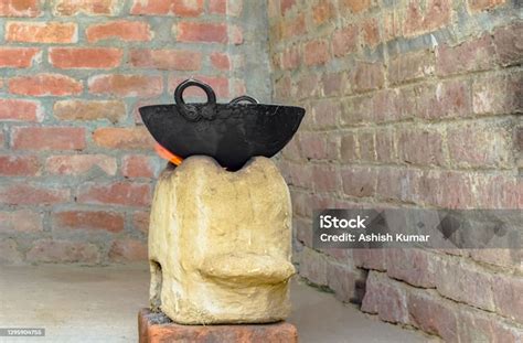 Traditional Indian Chulha Aka Stove In Flame With Black Cauldron And