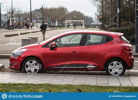 Profile View Of Red Renault Clio Parked In The Street Editorial Stock