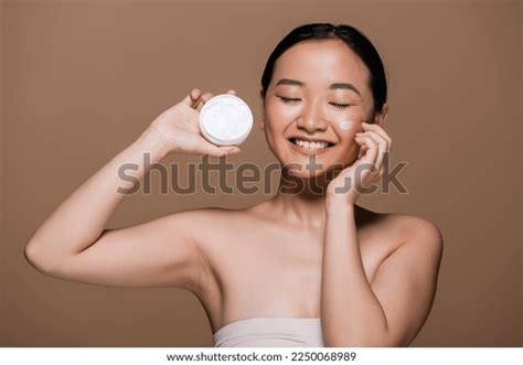 Positive Asian Woman Naked Shoulders Holding Stock Photo