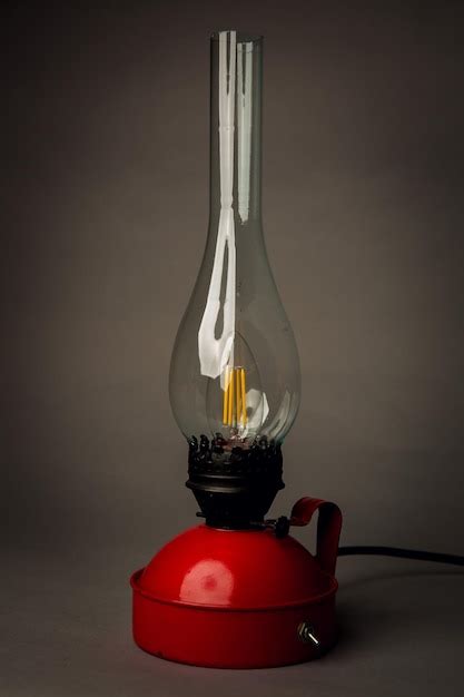 Premium Photo | A red lamp with a yellow lightbulb on it