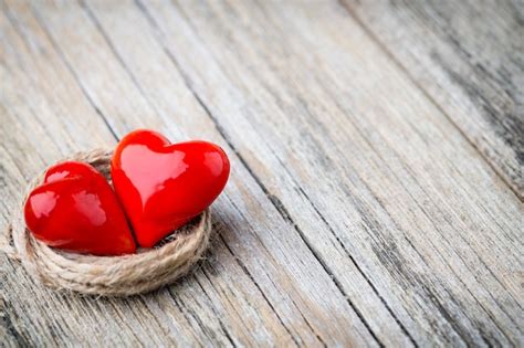 Premium Photo Red Heart Shaped On A Wooden Background