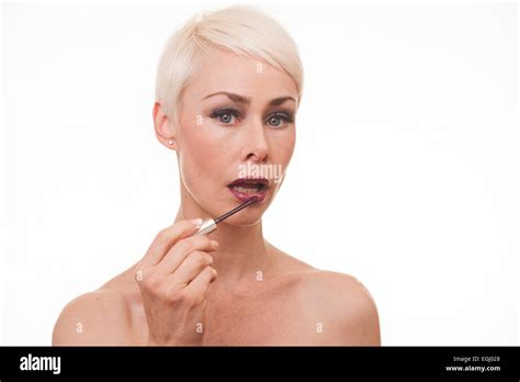 Mature Woman Applying Lipstick Hi Res Stock Photography And Images Alamy