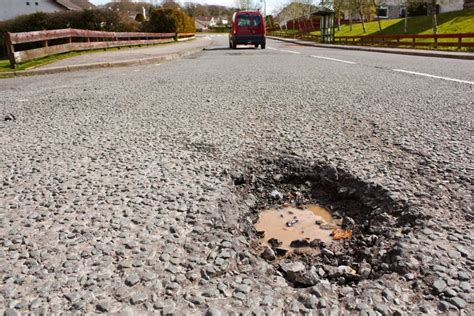 Pot Hole in Residential Road Surface Stock Photo - Image of ...