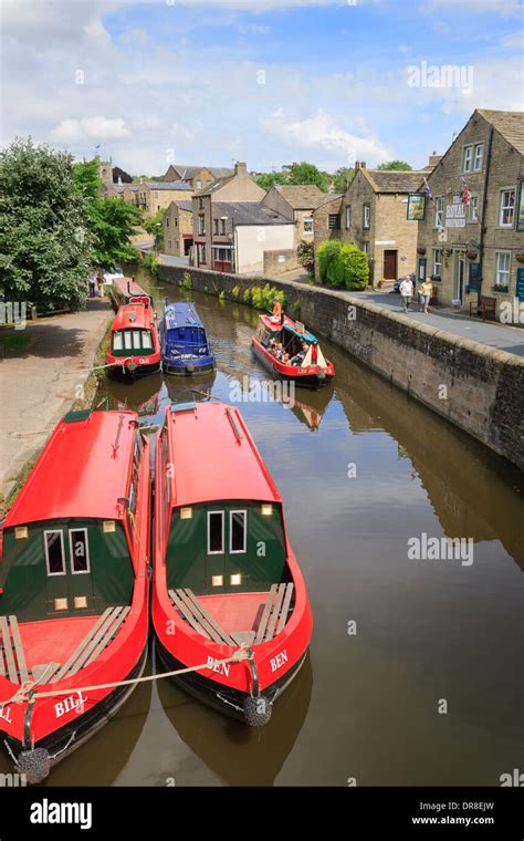 Narrowboats Moored By Wharf At Leeds And Liverpool Canal Basin Skipton