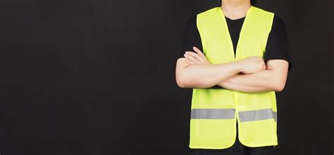 Premium Photo Man Wear Safety Vest On Black Background