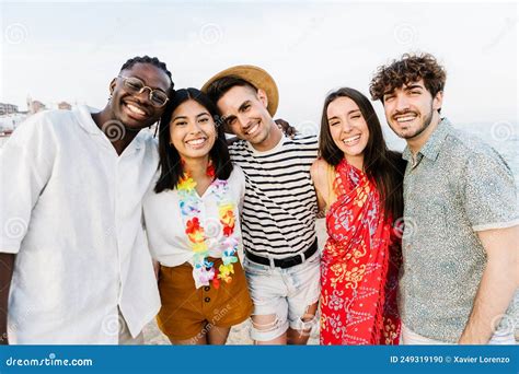 Group Portrait Of Multiracial Young Friends Outdoors In Summer Stock