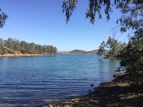 Premium Photo | A lake with a blue lake in the background