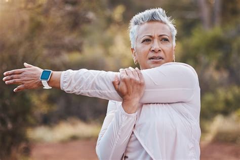 Premium Photo Exercise Stretching And Senior Woman Outdoor In Nature