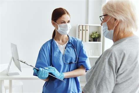 Premium Photo Side View Of Female Doctor Holding Dentures While