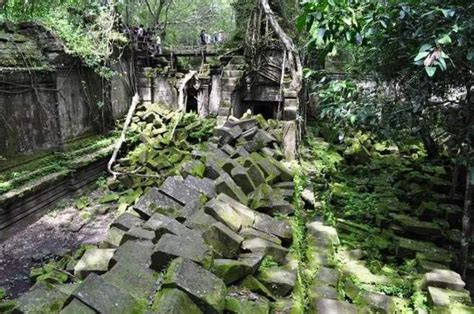 An Old Stone Structure In The Jungle With Moss Growing On It S Walls