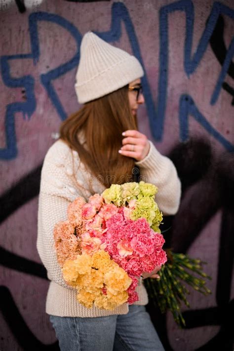 Cute Woman Holding Huge Bouquet Of Colorful Fresh Flowers Looking Away