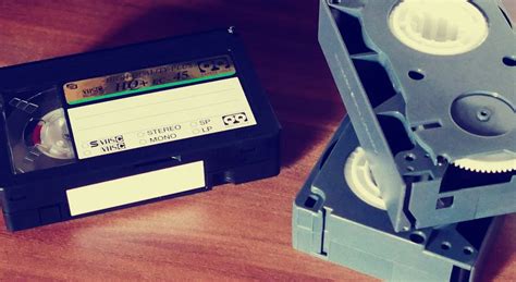 Betamax Tapes on Top of Brown Wooden Surface · Free Stock Photo