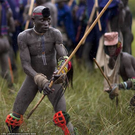 Suri Tribe In Ethiopia Battle Each Other With Sticks In 2021 Tribal Men Tribes Man Africa People