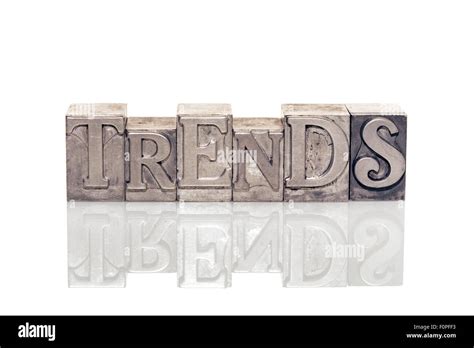 Trends Word Made From Metallic Letterpress Type On Reflective Surface