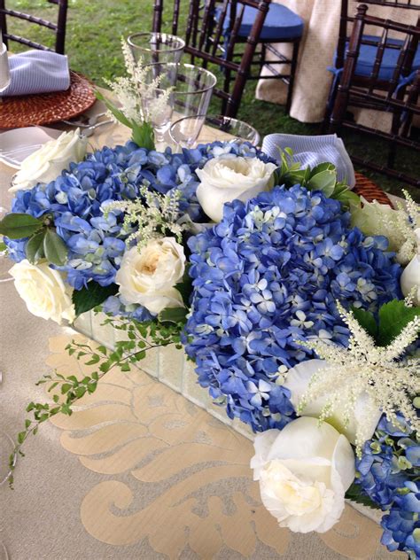 Blue Hydrangeas And White Roses Wedding Centerpiece By Floral