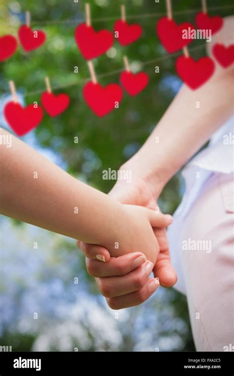 Composite Image Of Mother And Daughter Holding Hands Each Other Stock