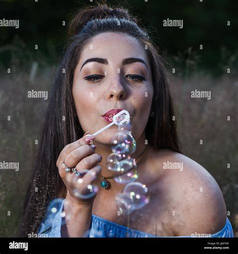 Girl blowing bubbles camera hi-res stock photography and images - Alamy