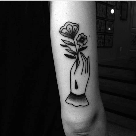 Hand with a rose - Tattoogrid.net