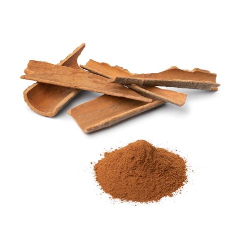 Premium Photo Dried Cinnamon Bark And A Heap Of Ground Cinnamon