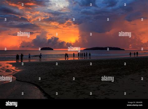 Beautiful Sunset With Silhouette Tourist At Tanjung Aru Beach Kota