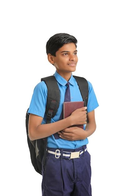 Premium Photo Indian School Boy In Uniform And Holding Diary In Hand