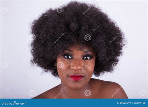 Portrait Of A Beautiful African American Woman With An Afro Hair Stock