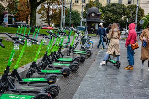 Rental Electric Scooters On The City Street Editorial Photography