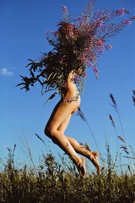 Naked Female With Big Bouquet Of Wild Flowers By Stocksy Contributor