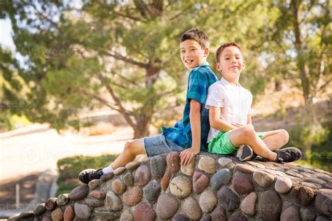 Outdoor Portrait Of Biracial Chinese And Caucasian Brothers