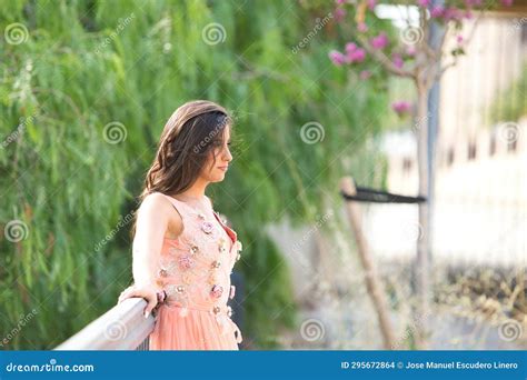 Beautiful Latin Woman With Long Curly Hair Poses As A Model Dressed In