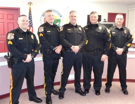 Clinton Township promotes five police officers, honors EMS chief ...