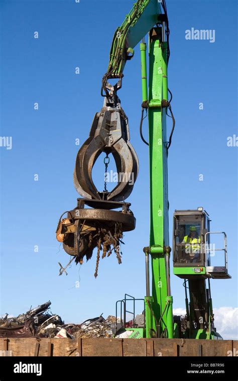 Electromagnetic Crane Lifting Scrap Steel For Recycling At The Pacific