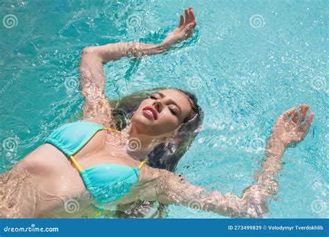 Beautiful Woman Wears Luxurious Bikini Swimsuit Posing In The Swimming Pool Female Model Relax
