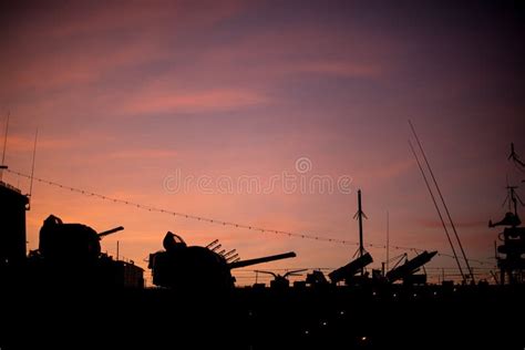 Sunset Silhouette of a Warship Stock Photo - Image of clouds, dawn ...