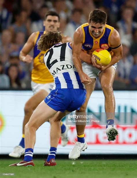 Andrew Gaff Of The Eagles Is Tackled By Miller Bergman Of The News