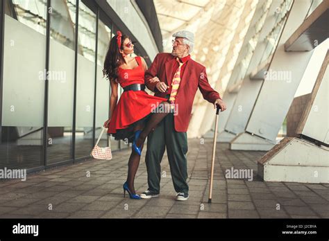 Old Man Dancing With A Young Girl They Dressed In Retro Stock Photo