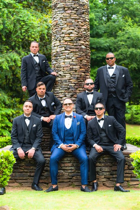 Download A Group Of Groomsmen Posing For A Photo | Wallpapers.com